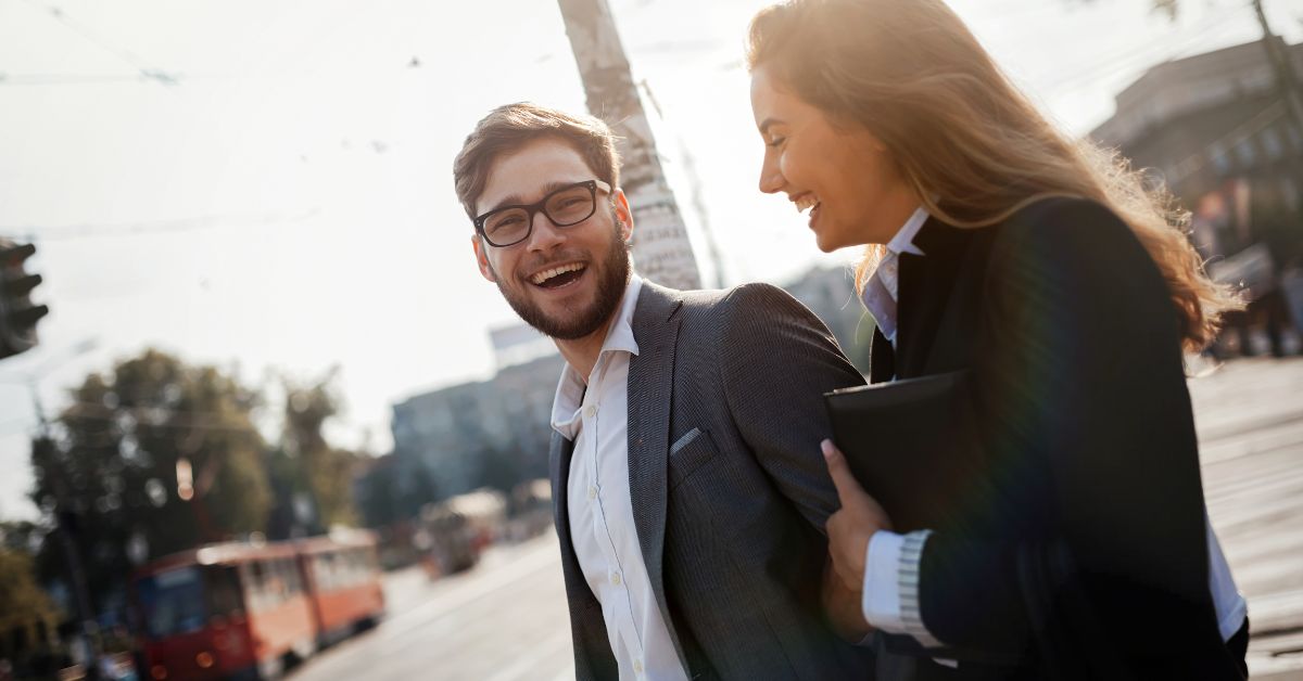 post-meal-walk-energy-stressfreelongevity Professionals taking a short walk outside during lunch break