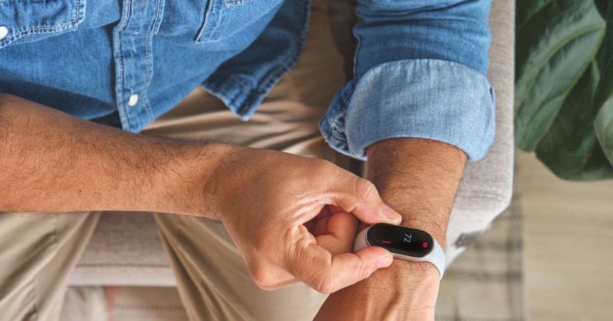 what-is-a-good-resting-heart-rate-stressfreelongevity Man checking resting heart rate of 72 bpm on smartwatch