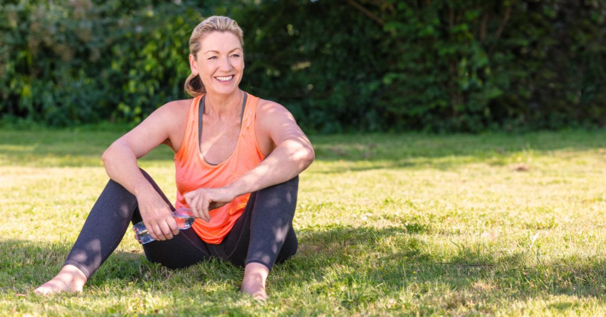 Woman relaxing outdoors after exercise