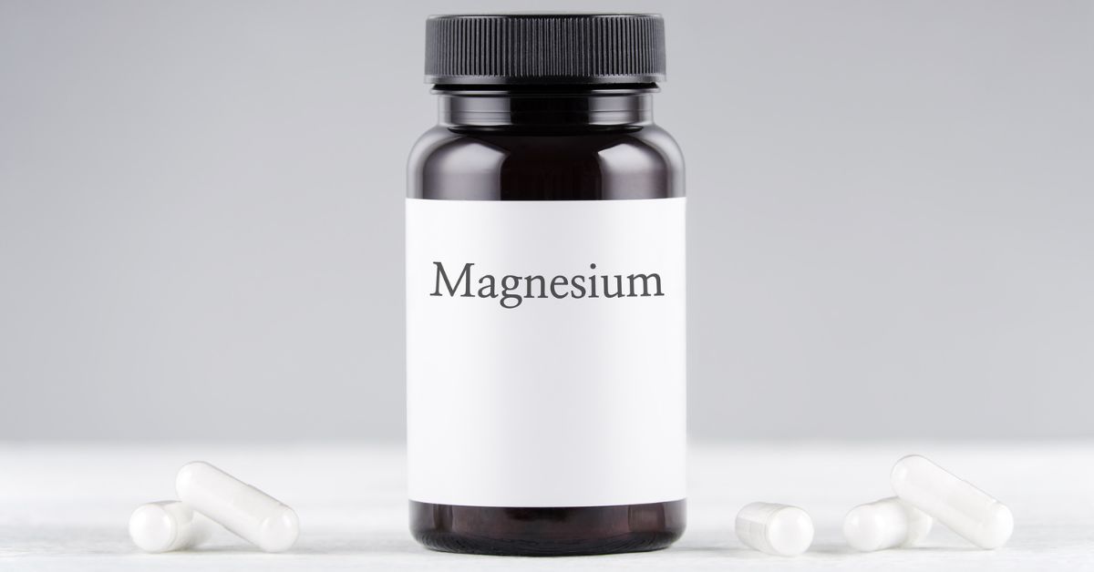 A bottle of magnesium supplement with capsules